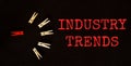 Red and brown text ÃÂ INDUSTRY TRENDS on the black background